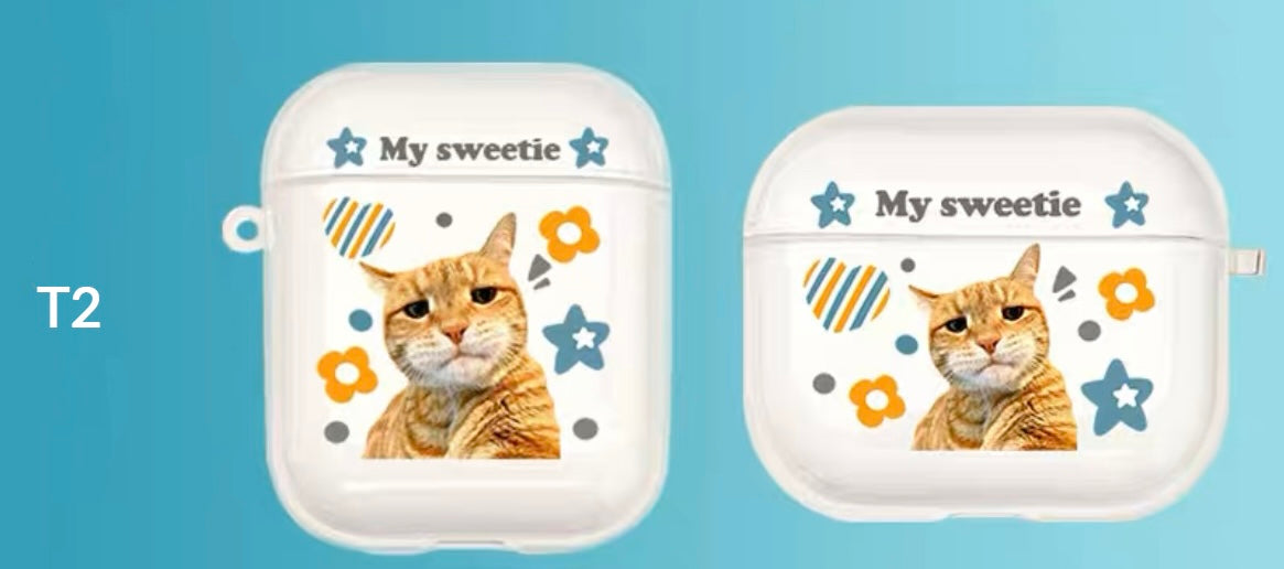 A custom AirPods case with a cat's face and the text 'My sweetie', along with decorative flowers and hearts.