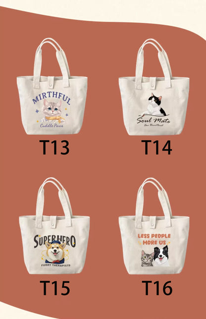 Four tote bags with cat-themed designs on a brown background.