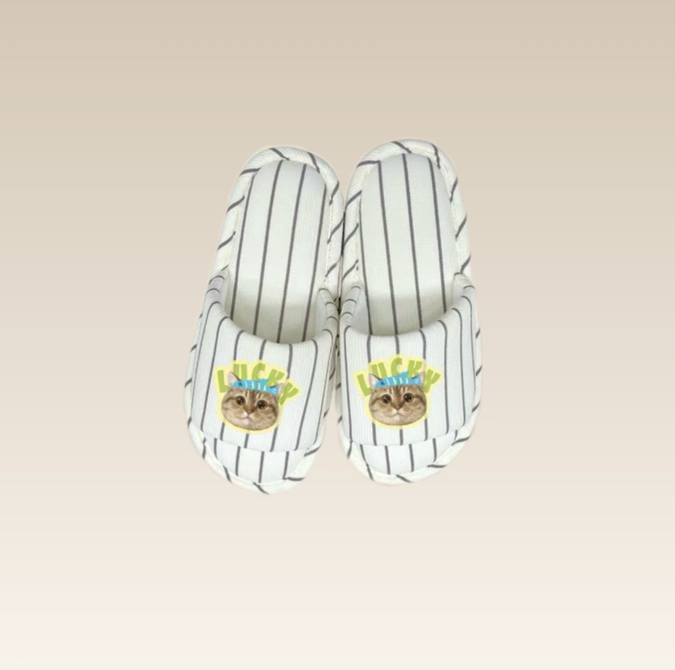 Pair of open-toe striped slippers with a cat design 