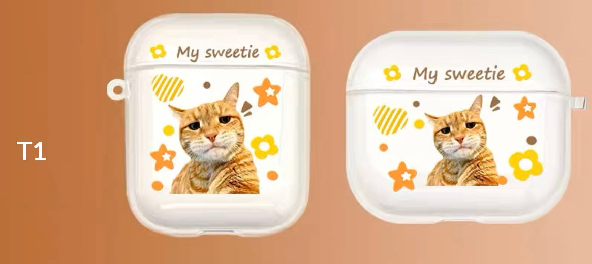A custom AirPods case with a cat's face and the text 'My sweetie', along with decorative flowers and hearts.