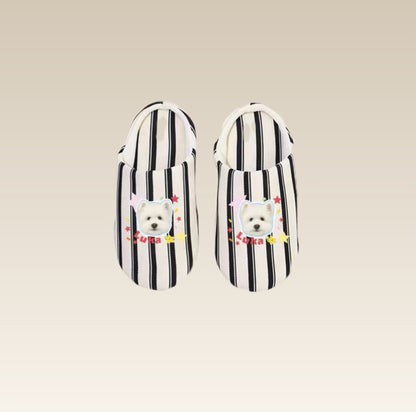 Pair of black and white striped slippers with a dog design 